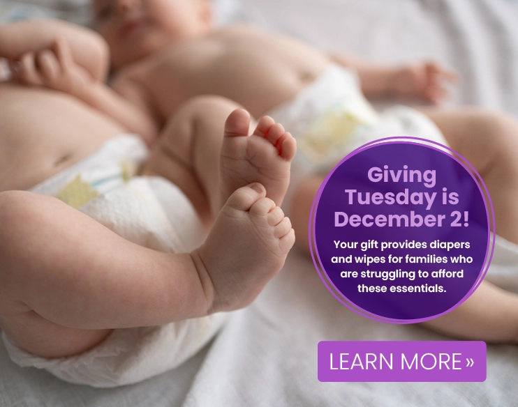 Two babies wearing diapers lie on a soft surface. A purple circle overlay announces "Giving Tuesday is December 2," offering support for families in need of diapers and wipes.