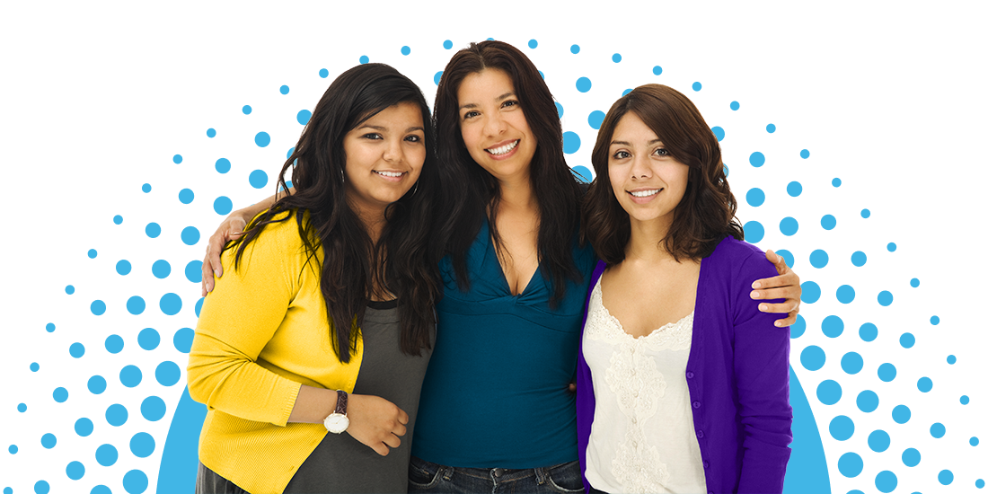 Three women standing side by side, smiling at the camera, with their arms around each other, against a blue background.